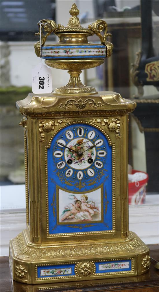 A late 19th century Louis XVI style gilt spelter eight day striking mantel clock, with Sevres style inset panels, 19.75in.